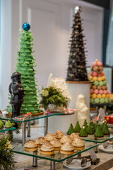Christmas decorated desserts and sweets displayed for festive catering buffet. New Year cookies, cakes and candys