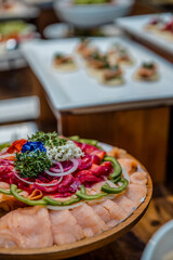 Seafood bar among catering banquet table. Variety of snacks, appetizers, seafood and cooked meals displayed as buffet for wedding, Christmas, business corporate, birthday party or other event