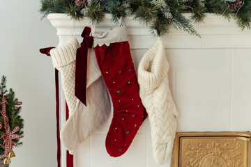 Christmas stockings hanging by fireplace at home. Winter holiday background