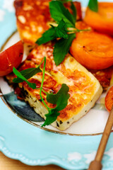 Halloumi cheese with apricots on an outdoor grill