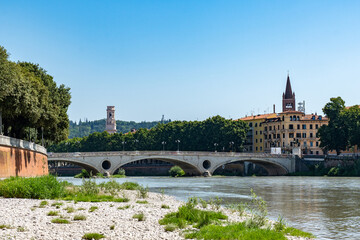 Naklejka premium View of the Bridge Ponte Pietra in Verona on Adige river. Veneto region in Italy