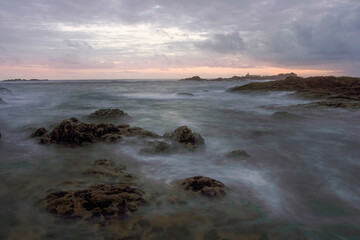 Rocky sea beach at dusk