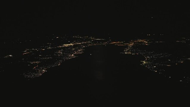 Aerial view of the city of Chalcis in Greece at night.