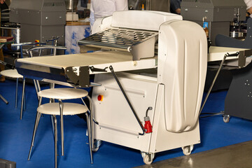 Bakery equipment, maneuverable molding machine in a bakery shop.