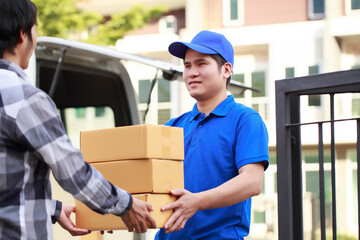 The courier brings the product to the customer's home, The parcel delivery driver is doing his job very well, The delivery staff brings the packed boxes to the customers safely.