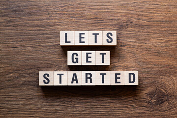 Lets get started - word concept on building blocks, text