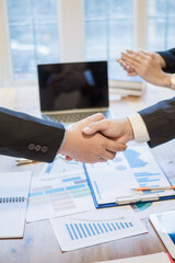 Businessmen and investors join hands symbolize friendship and cooperation in business success....