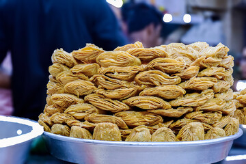 Khaja the Sweets made with flour dough layer by layer then fried and dipped in sugar syrup becomong delicoius tasty desert.