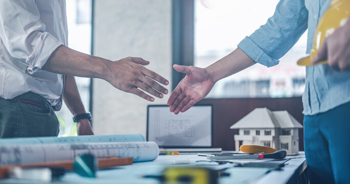 shake hands, management, home, idea, architect, constructor, builder, architectural, blueprint, brainstorm. engineers and team shake hands around blueprint and structure with controller smart home hud