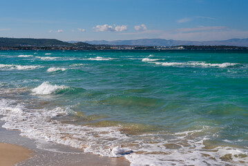 Closeup of sand on beach and blue summer sky. Panoramic beach landscape. Empty tropical beach and seascape