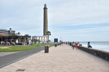 Tourists stroll on the Meloneras seafront in Gran Canaria, Canary Islands - 681696159