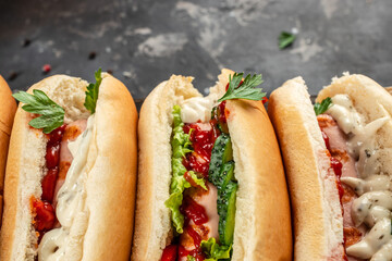 Set of various hot dogs on a dark background. top view. copy space