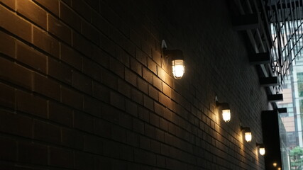 Brick building wall with lights