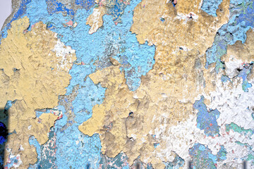 old blue yellow paint on a wall