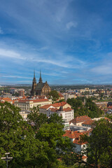 Fototapeta na wymiar View of the city of Brno in the Czech Republic in Europe from the Špilberk viewpoint. The dominant feature of Brno is the Cathedral of St. Peter - Petrov. There is a beautiful sky in the background..​