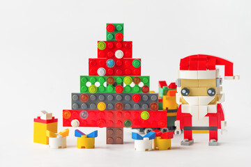 Merry Holiday Creations: Santa Claus, Gift Boxes, and Toy Christmas Tree Made from Building Blocks. Happy New Year