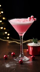 Martini cocktail decorated with berry. Pink cocktail with christmas decoration