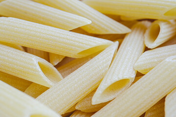 Close up uncooked pasta semolina penne rigate