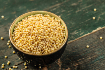 Ptitim. Israeli couscous on a wooden background. top view. copy space