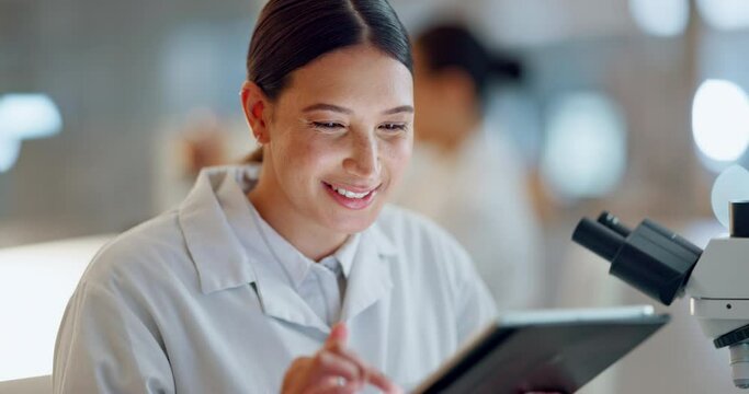 Science, research and woman with microscope, tablet and biotech data report in laboratory. Medical exam, scientist or lab technician in study for healthcare, medicine and vaccine test feedback