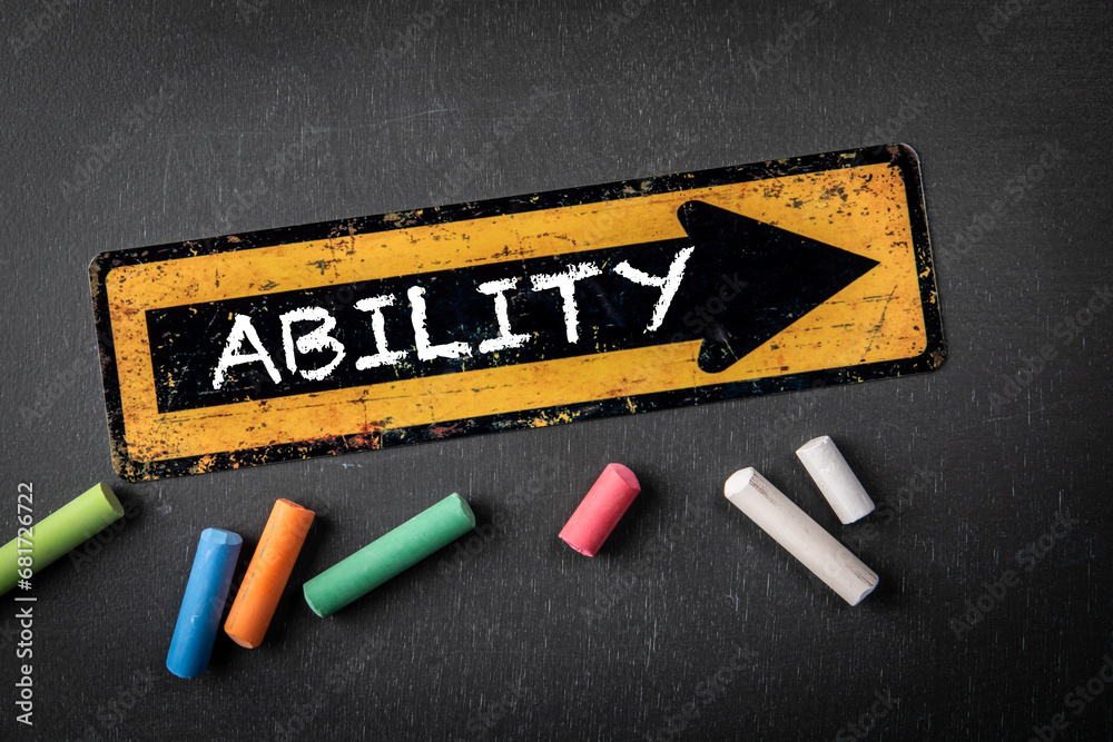 Wall mural ability concept. direction arrow with text on a dark chalkboard background