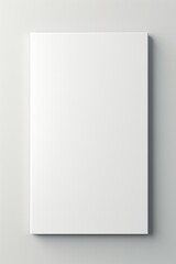 A blank white square box displayed on a wall. Suitable for various creative projects and design concepts.