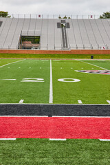 Scheumann Stadium Ball State with Cardinals team colors on football field and empty stands