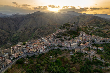 Fototapeta na wymiar Aerial view of old picturesque town of Forza d'Agro at sunset