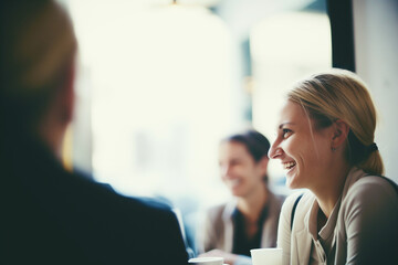  A woman shares a heartfelt laugh during a genuine conversation in a cafe, the image capturing an unfeigned moment of joy and engagement in a real-life setting. - obrazy, fototapety, plakaty