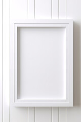 Mock up of close up white photo frame with boarder, on plain white wall, natural brigth light