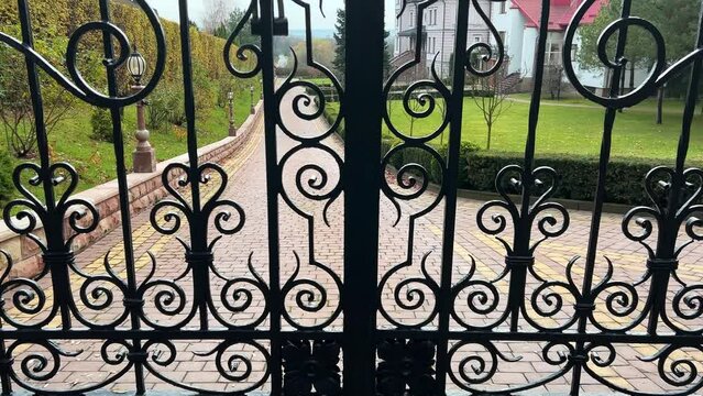 Forged metal gates. Architectural element.