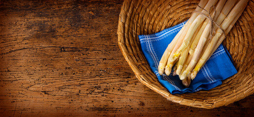 still life with a fresh white asparagus in a basket