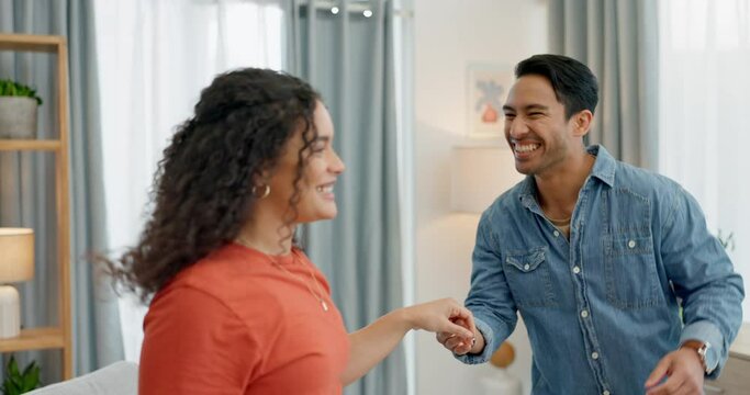 Real estate, celebration and couple dance in living room happy, smile and having fun in their new house. Property, success and excited people enjoy freedom, energy and music after moving in together