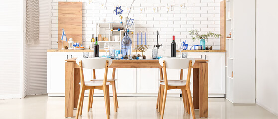 Festive table setting for Hanukkah in kitchen