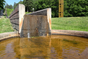 Streaming water at a aqueduct. Summer day. Stockholm, Sweden.