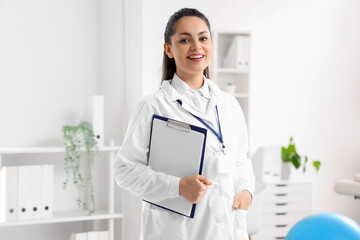 Female physiotherapist with clipboard in rehabilitation center