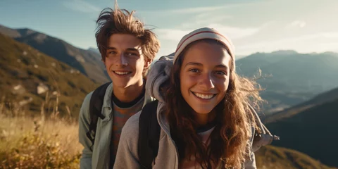 Poster teens boy and girl hiking in the mountains and have fun © Karat