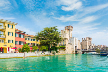 Obraz premium Sirmione Lombardy, Italy - August 20 2019 - Tourists visiting the popular historic attraction