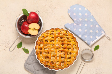 Baking dish with delicious apple pie on white background