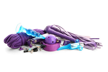 Purple and blue sex toys on white background