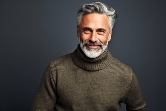 Portrait of a handsome mature man in a sweater. Men's beauty, fashion.