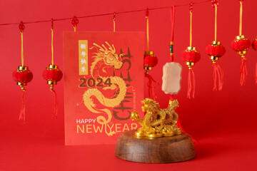 Golden dragon figurine greeting card and lanterns on red background. Chinese New Year celebration