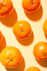 Many sweet mandarins on yellow background