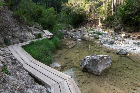Wooden path over Matarrana river at The Parrizal spot in Beceite, Teruel, Spain