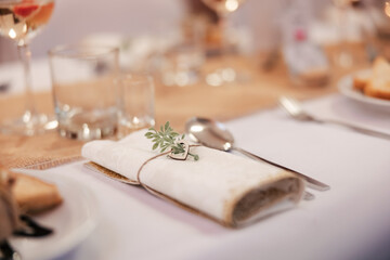 a shot of a decorated wedding table with food and drinks, wedding table settings