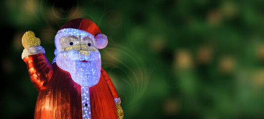 Closeup of a Santa Clause on green bokeh background with floral swirl. Christmas Greeting. Copy Space.