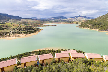 Resort cabins on a reservoir lake in Bou Agroub, Tunisia.