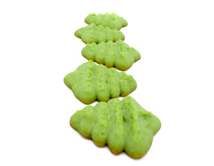Close up photo of a row of green spritz christmas tree cookies