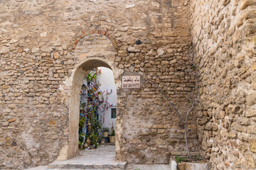 Fototapeta na wymiar Doorway through a stone wall in Tunisia.