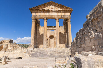 Fototapeta na wymiar The Capitol Temple at the Roman ruins of Dougga, Tunisia.